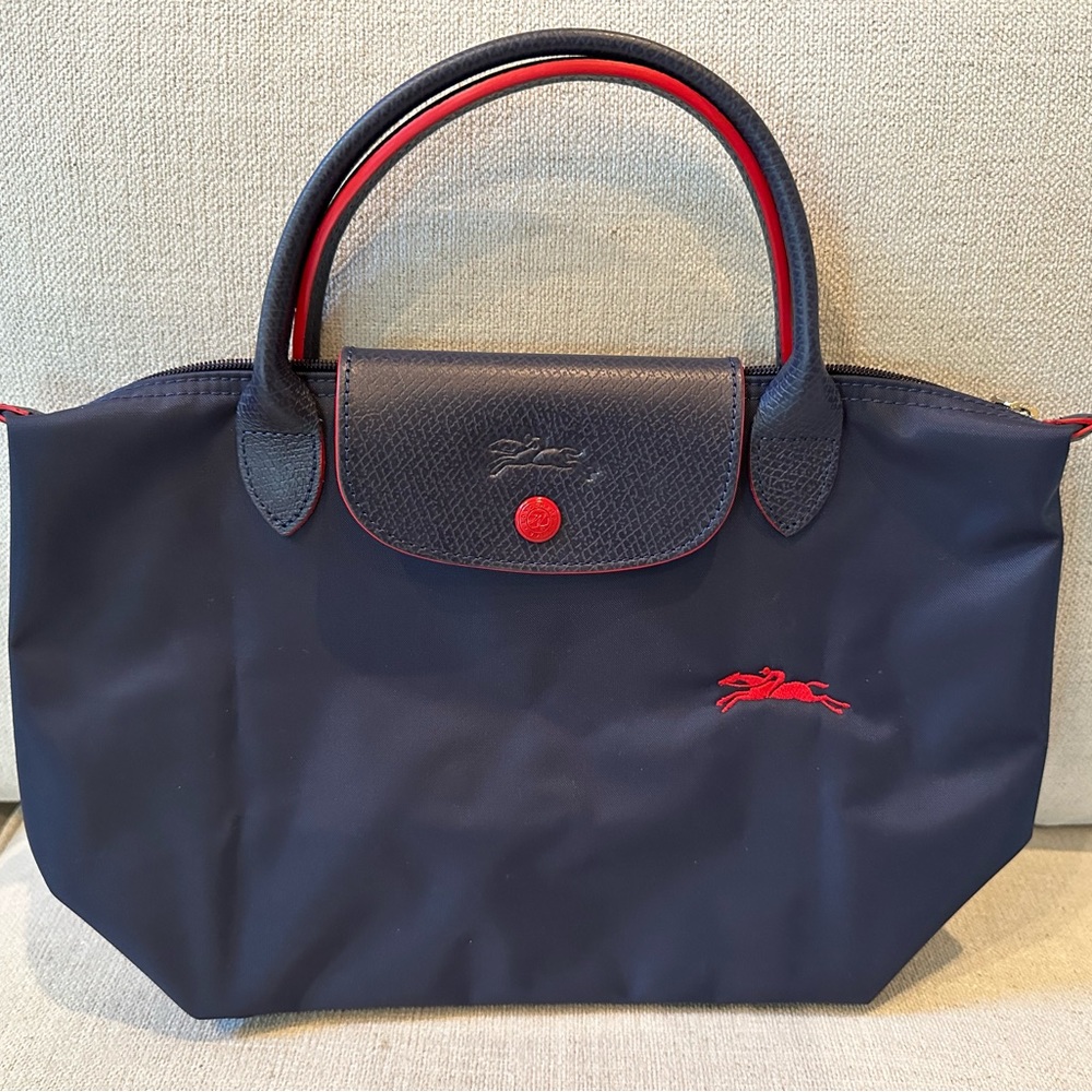 LONGCHAMP Mini Le Pliage Navy Blue with Red Trim. Leather Handles. BRAND NEW